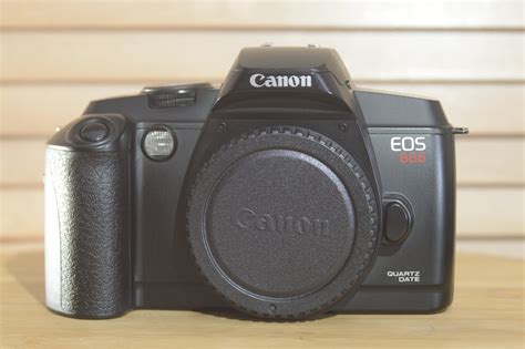 Canon EOS 888 Quartz Date 35mm Film Camera. Also known as .